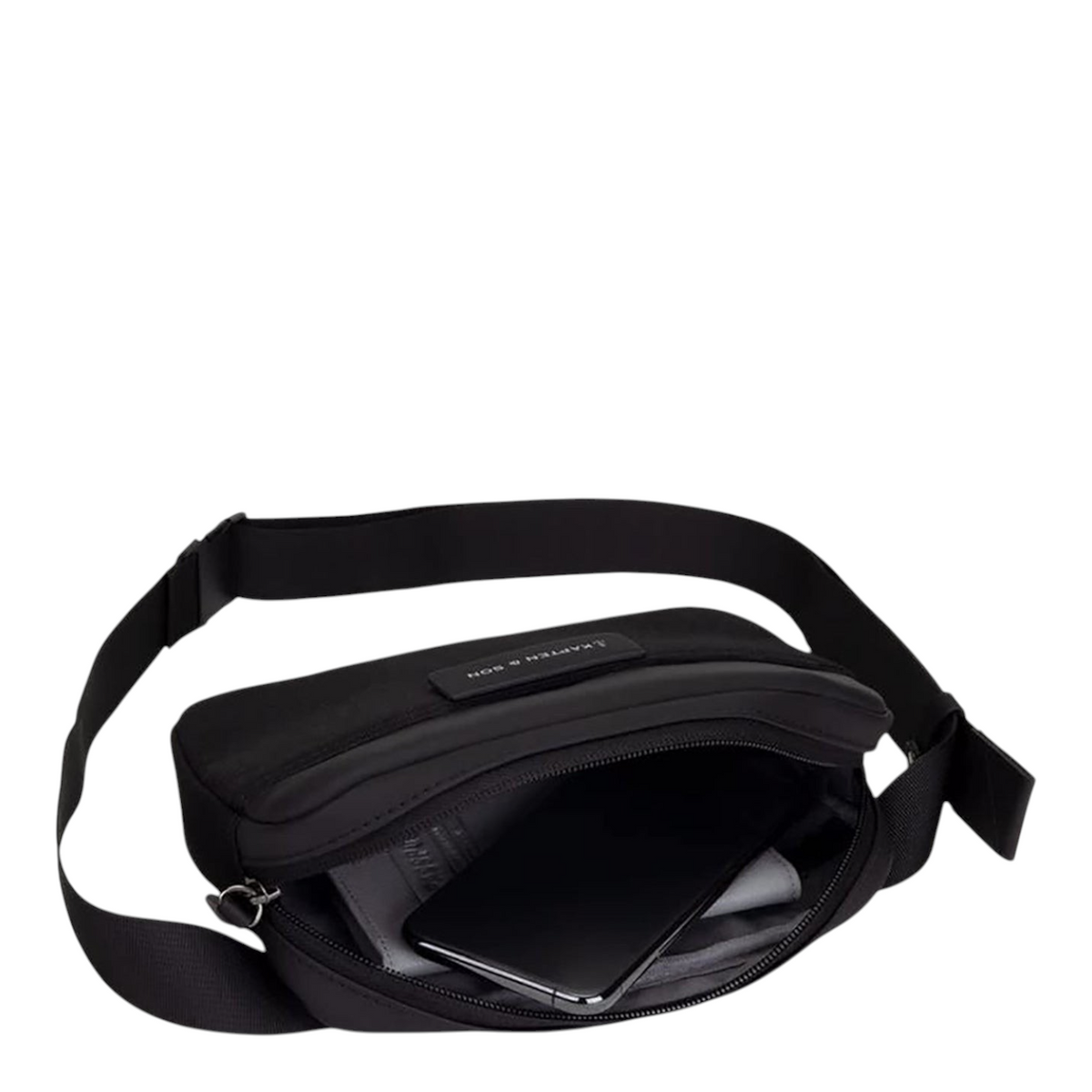 Lieblingstasche Habo black crossbody bag with open zipper showing internal storage for smartphone and essentials