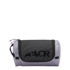 Lieblingstasche AEVOR Wash Pack in light purple and black with a durable zip closure and branded front panel.