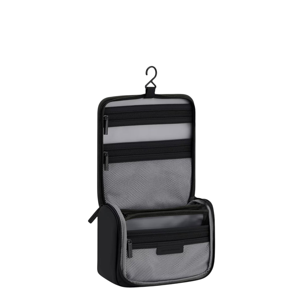Lieblingstasche Bali washbag in black with multiple internal mesh compartments and a hanging hook for travel