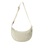 Lieblingstasche beige crescent-shaped sling bag with an adjustable strap and minimalist design