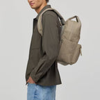Man wearing a beige Lieblingstasche Bergen Pro Limited Edition Cord backpack with textured fabric side view