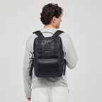 Lieblingstasche Bergen Ultra black backpack worn by a man, featuring a front mesh pocket and durable design