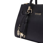 Lieblingstasche black ECS Satchel S handbag with gold hardware, braided handle details, and logo charm