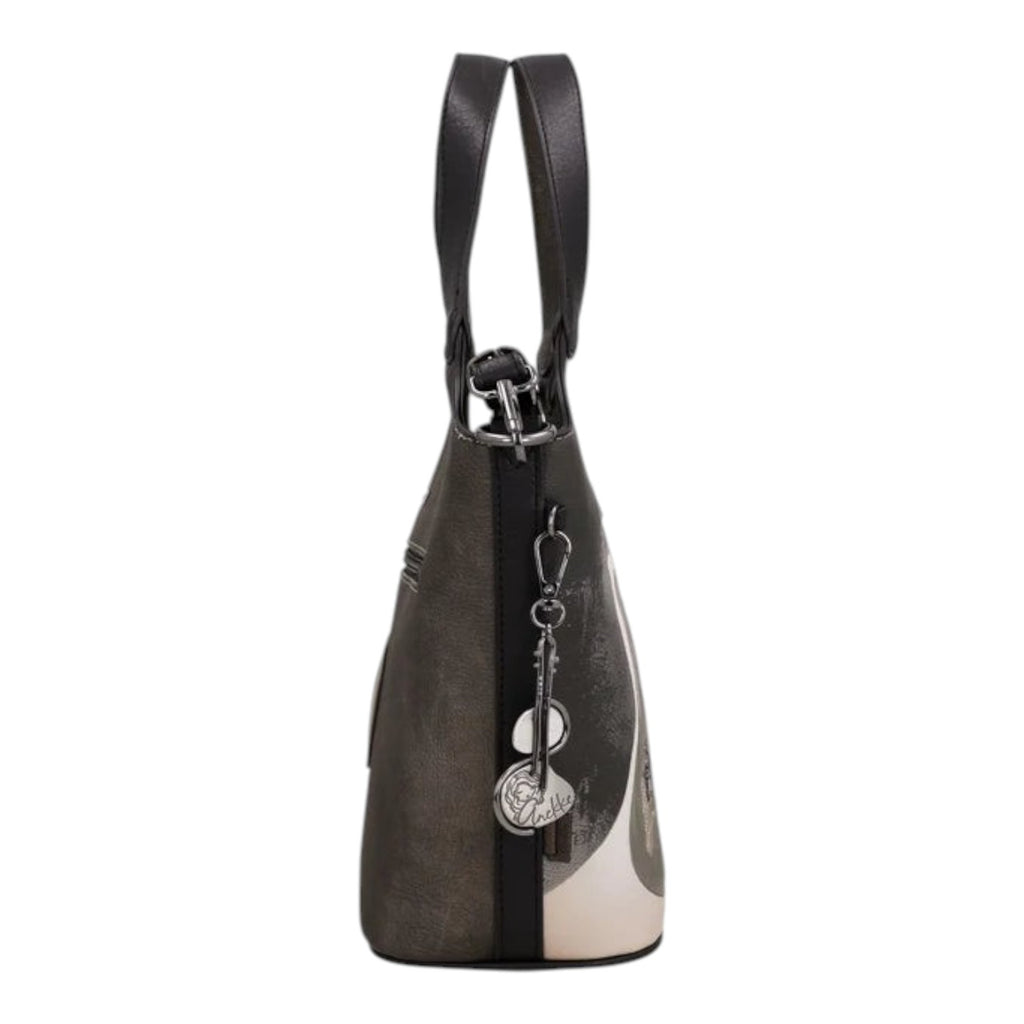 Lieblingstasche short handle bag in black and grey with a decorative metal charm, side view