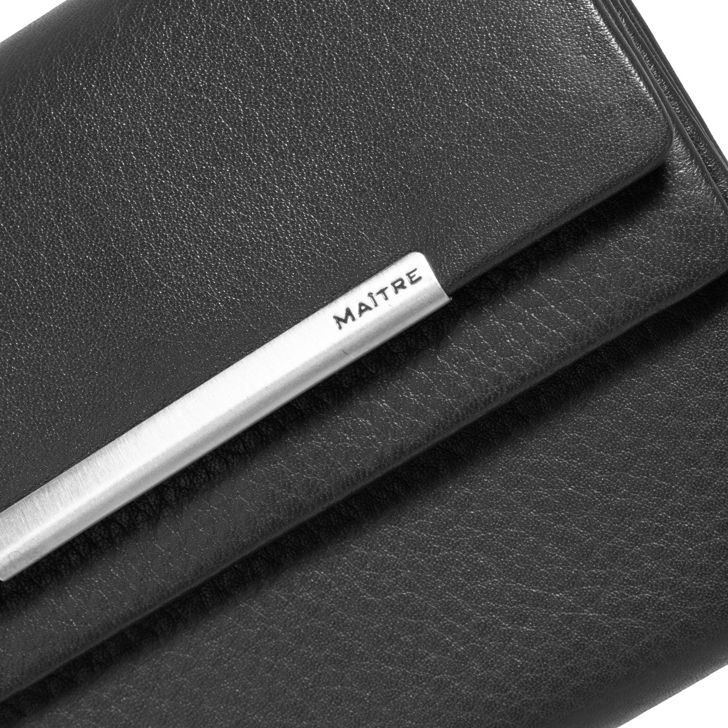 Lieblingstasche black leather clutch purse with silver metal bar detail and MAITRE logo