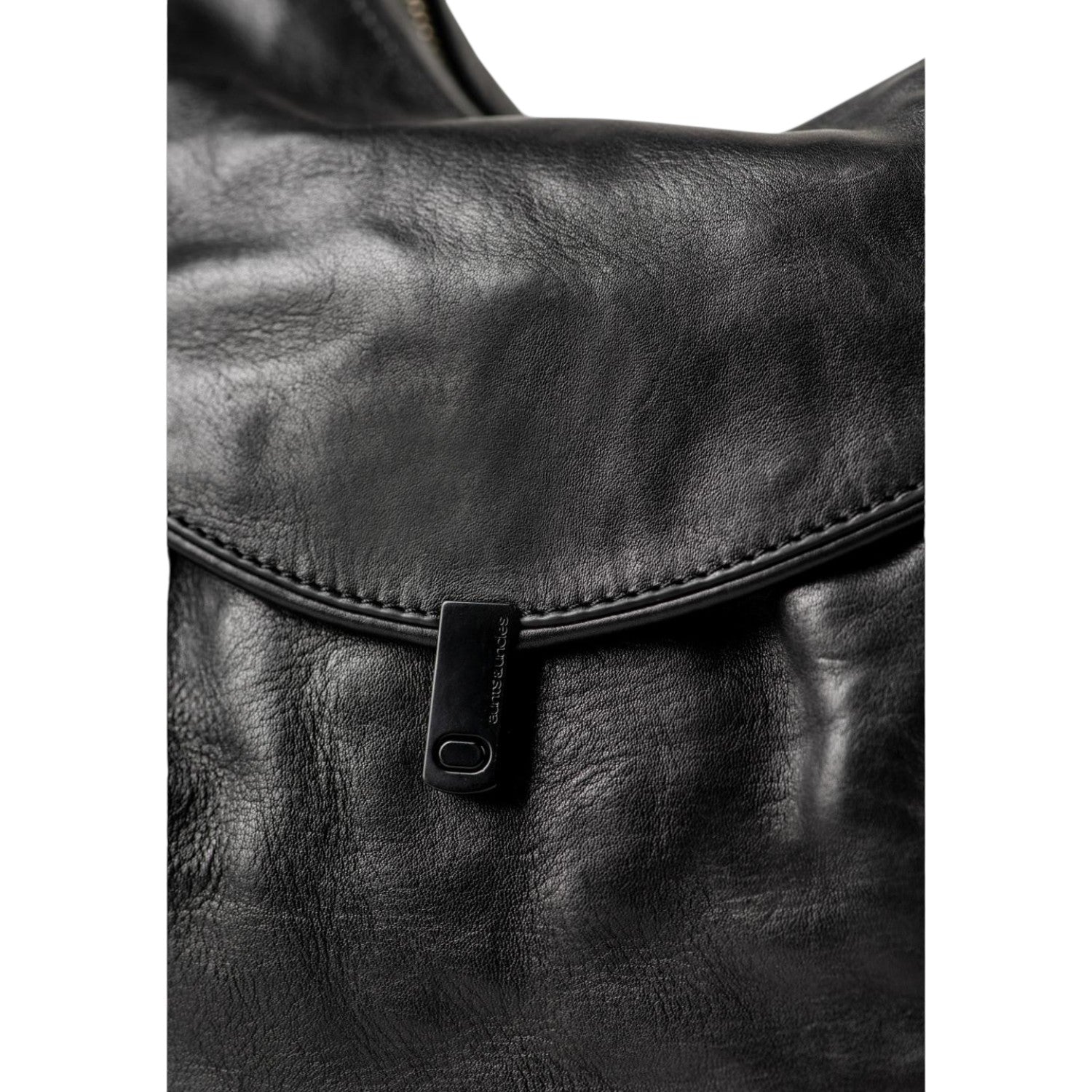 Lieblingstasche Mrs. Banoffee Pie black leather handbag with a minimalist metal clasp closure