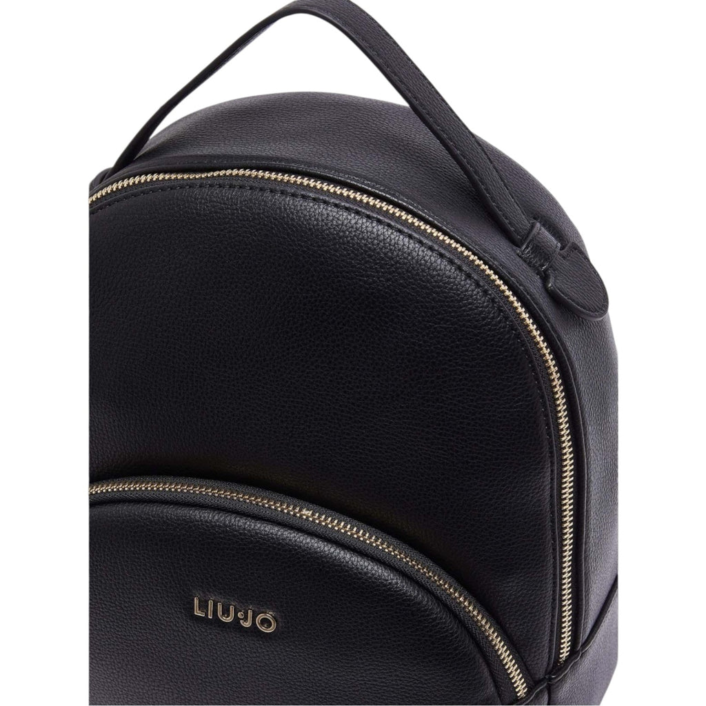 Lieblingstasche ECS Backpack M in black pebbled faux leather with gold-tone zipper details and front logo
