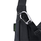 Lieblingstasche black sling bag with a silver carabiner and Eco & Social side label detail