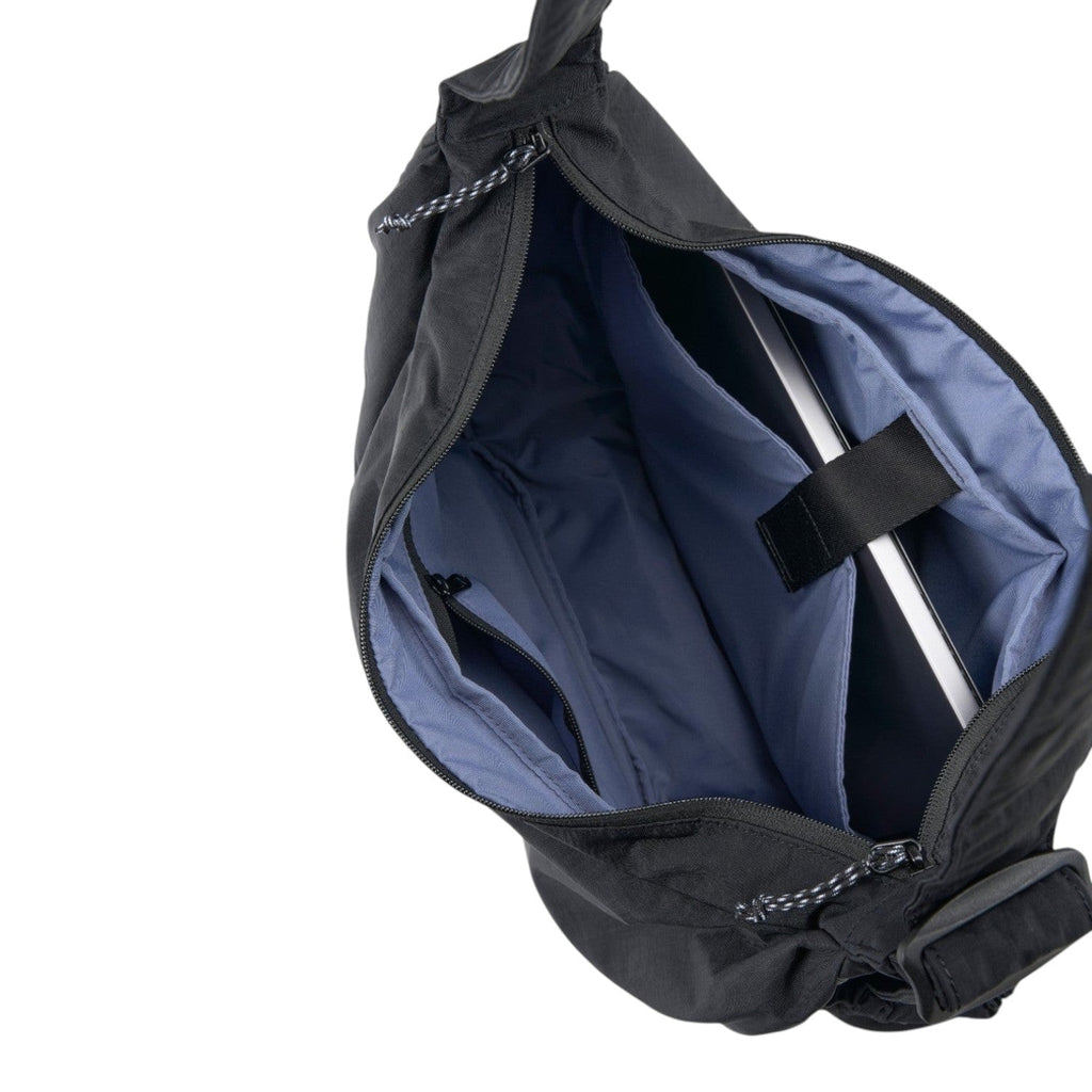 Lieblingstasche black slouchy bag with open zipper, blue interior lining, and a dedicated laptop compartment.