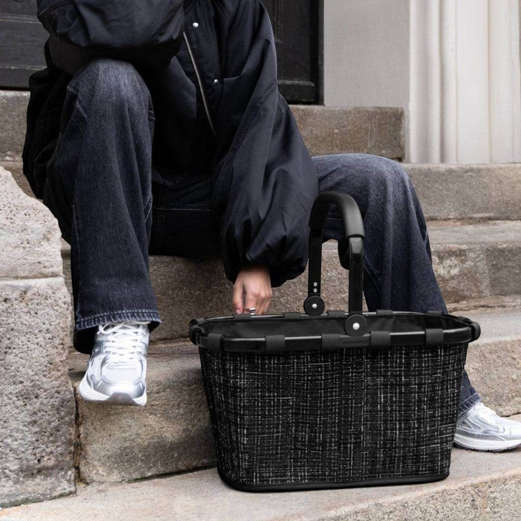 Lieblingstasche black woven carrybag with black handles, a stylish and practical accessory.