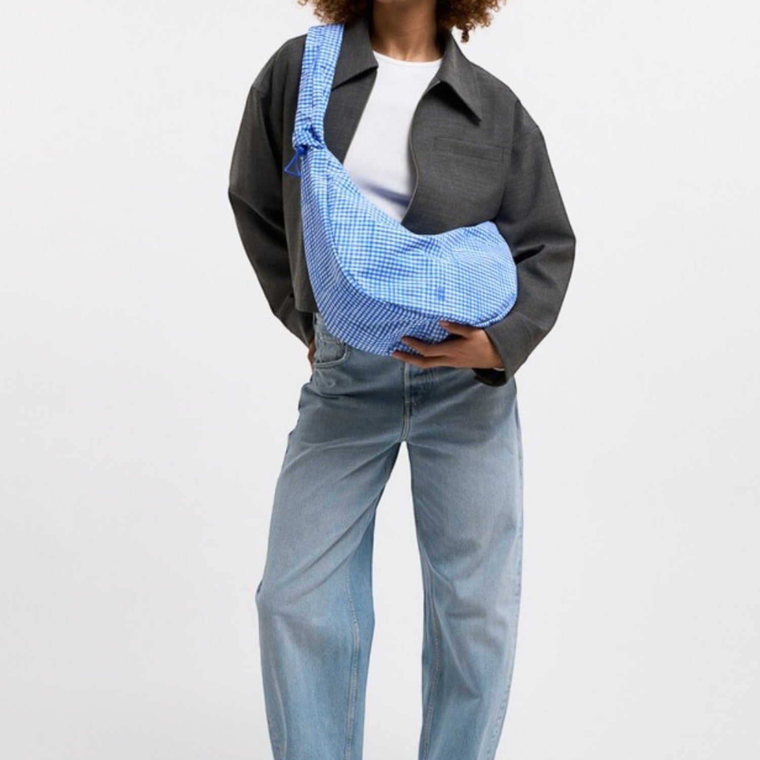 Lieblingstasche large blue gingham moon bag with ruffle detail and adjustable strap.