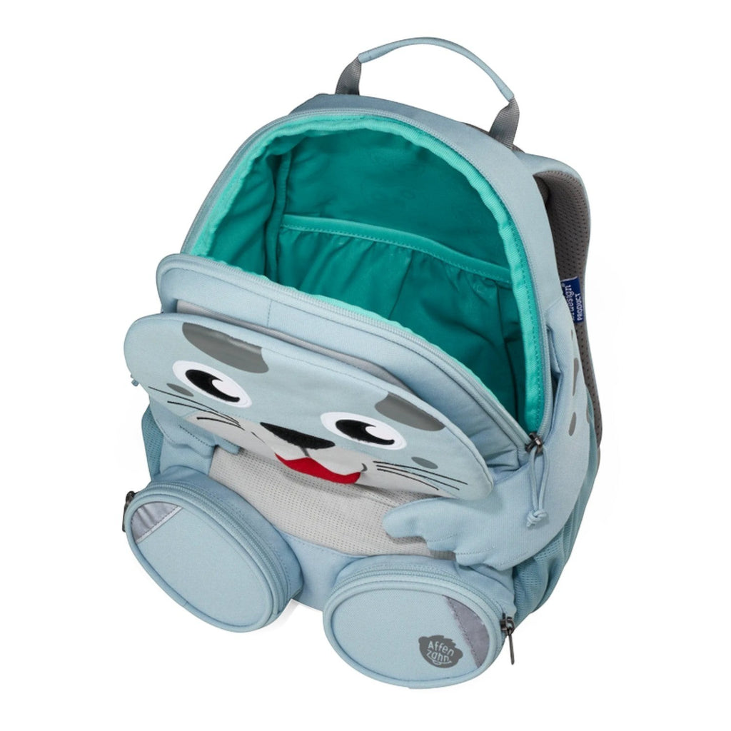 Lieblingstasche light blue seal-shaped backpack for kids with cute face and teal interior. Features two side zip pockets.