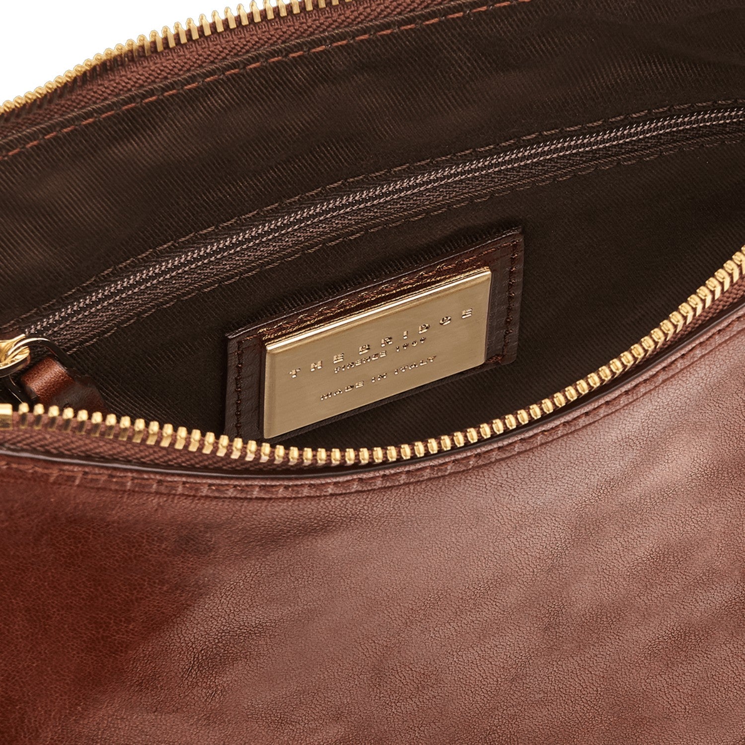 Lieblingstasche brown leather shoulder bag with zipper closure and gold-tone hardware.