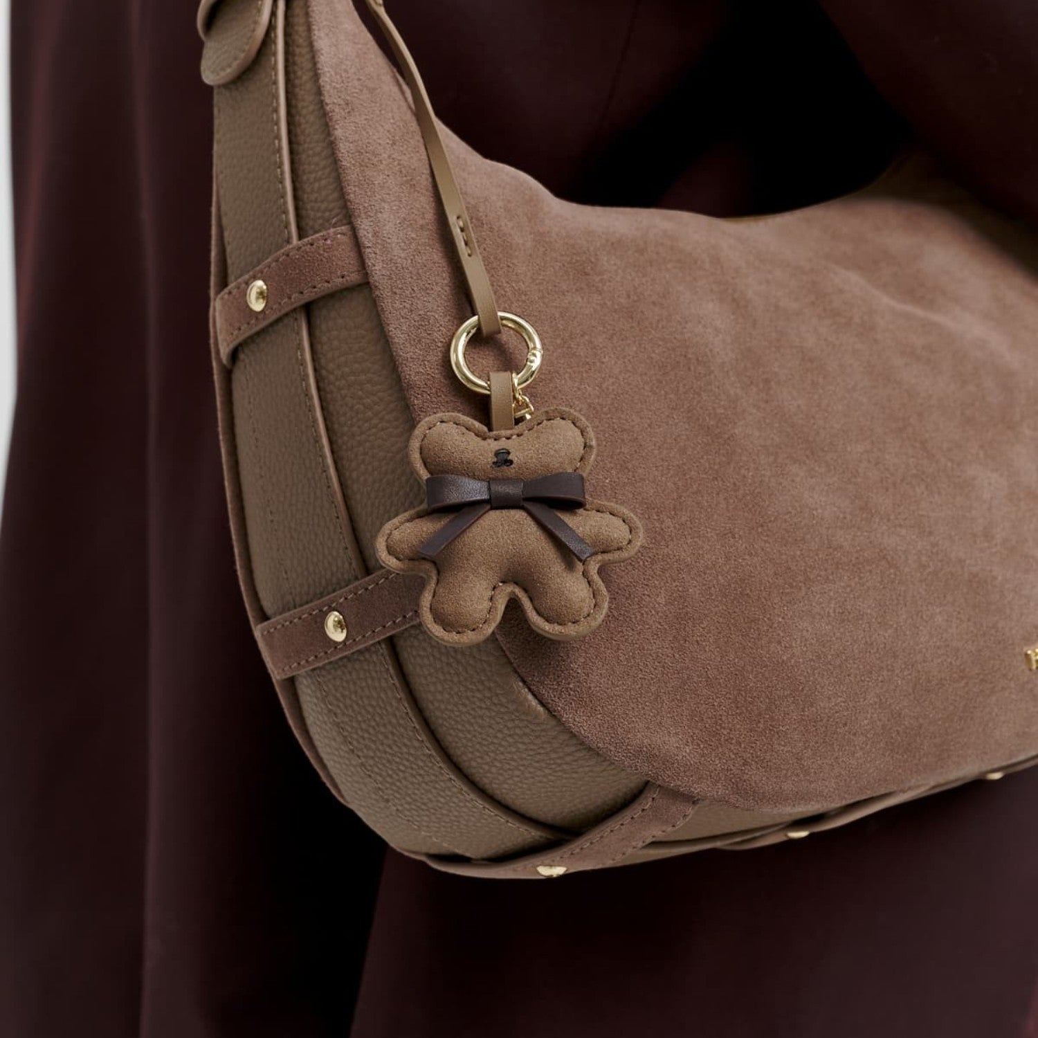 Lieblingstasche Teddy Charm brown suede and leather hobo bag with a cute bear-shaped pendant and gold hardware