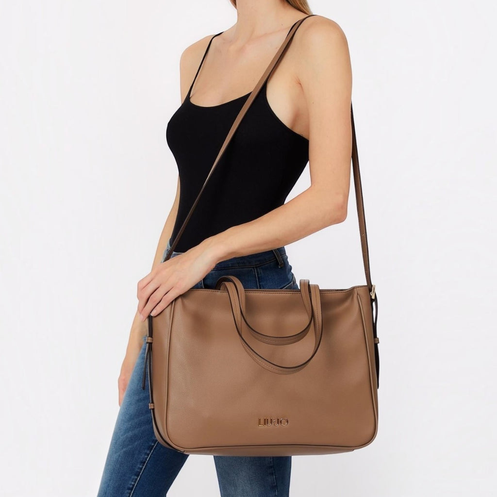 Lieblingstasche brown faux leather Tote L handbag with shoulder strap worn by a woman