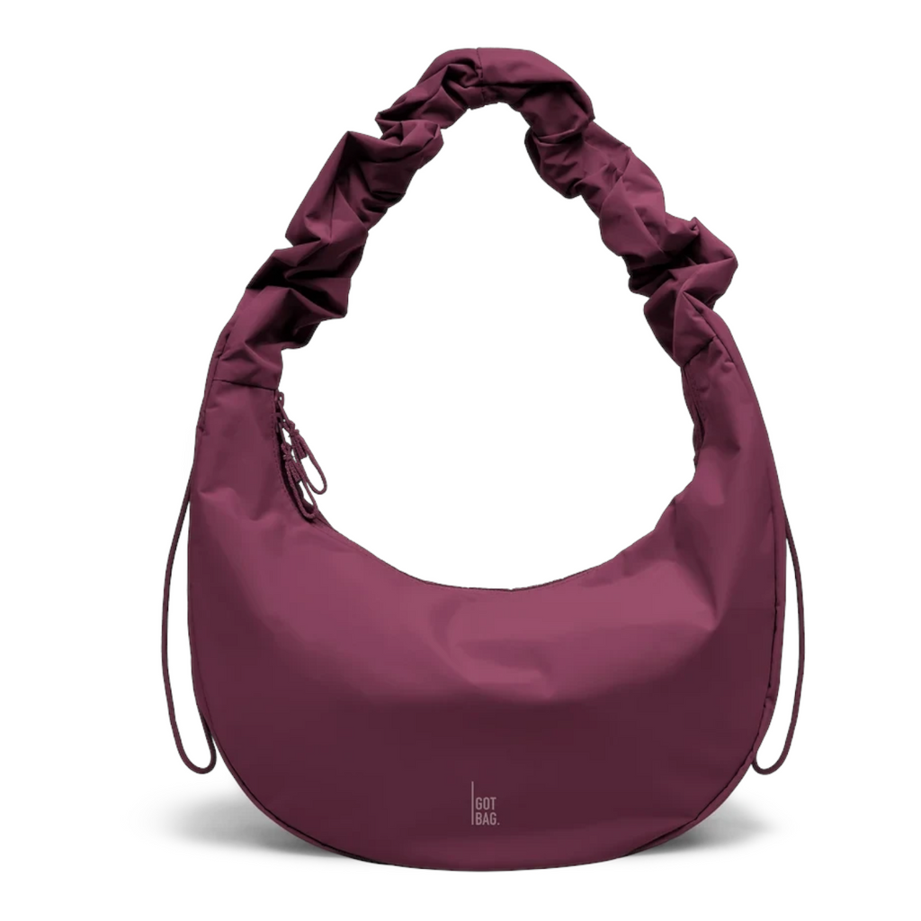 Lieblingstasche Moon Bag Ruffle Large in deep burgundy with a unique gathered shoulder strap and crescent shape