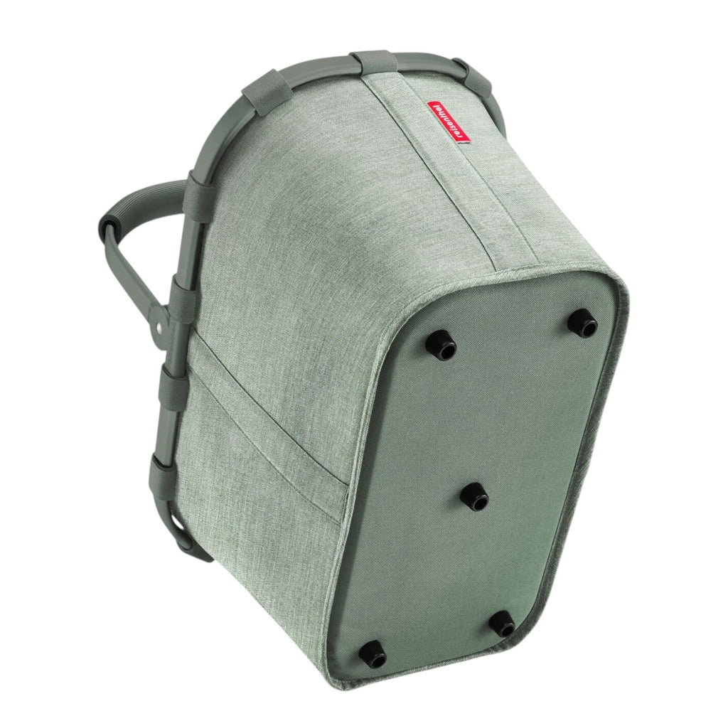 Lieblingstasche Carrybag in sage green with a sturdy aluminium handle and protective feet, shown from below.