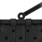 Lieblingstasche Carrybag XS in black with a subtle polka dot pattern and a sturdy black folding handle