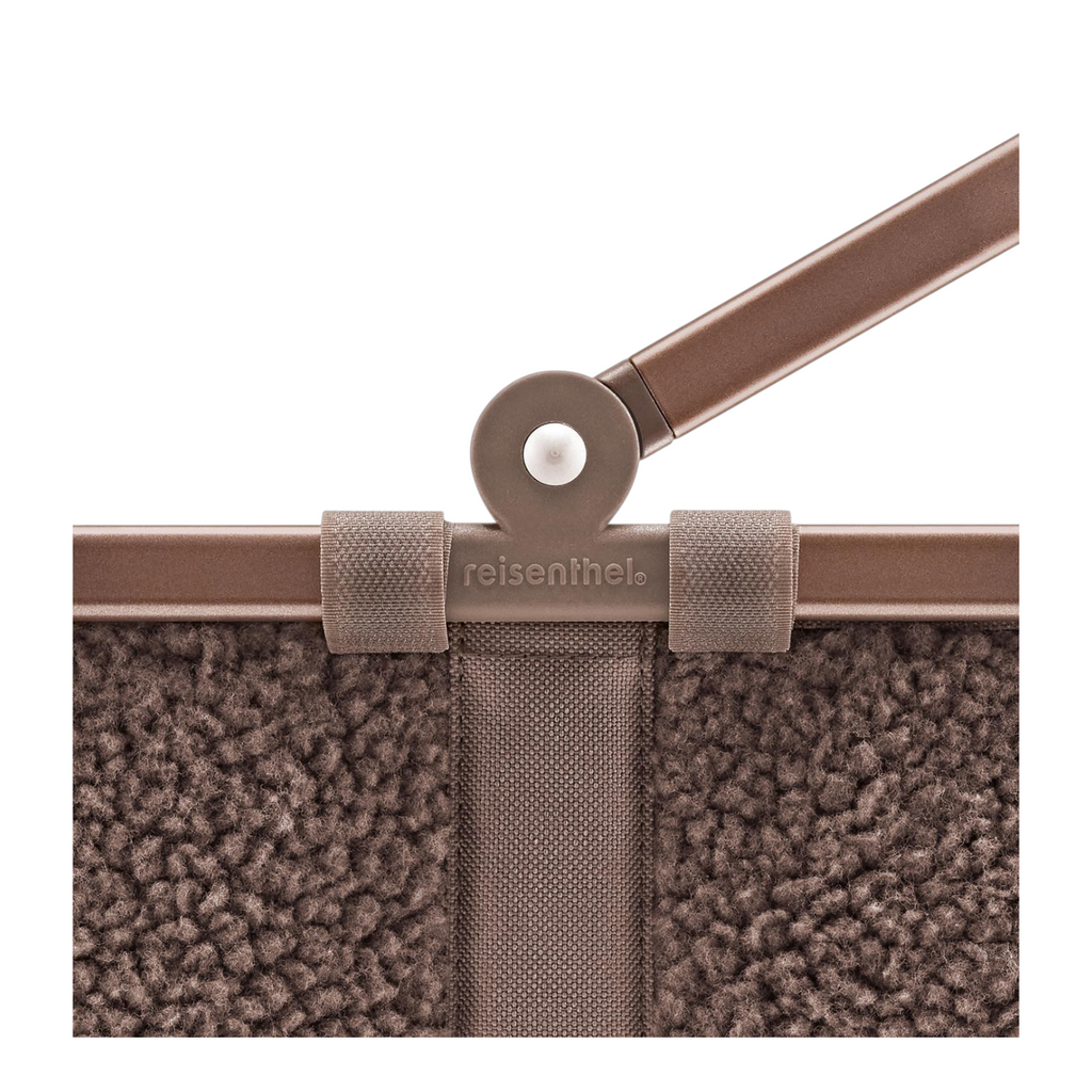 Lieblingstasche Carrybag XS in brown teddy fleece material with a sturdy handle hinge detail