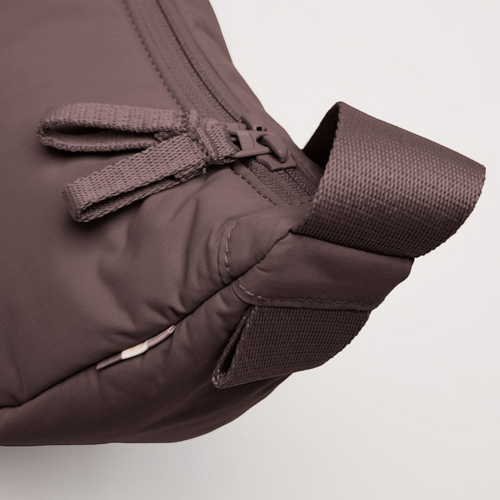 Lieblingstasche Cloud Moon Bag Small in dark mauve featuring a durable nylon fabric and matching zipper detail.