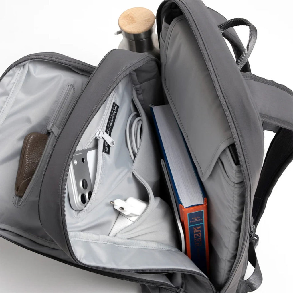 Lieblingstasche Commuter Pack in grey with open compartments, organized pockets, and a laptop sleeve.