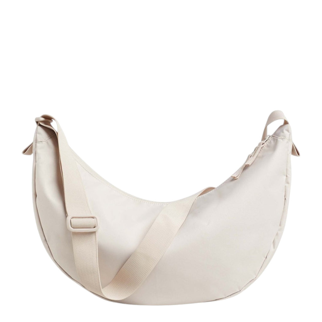 Lieblingstasche large cream crescent-shaped nylon shoulder bag with adjustable strap.