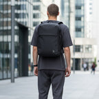 Lieblingstasche Commuter Pack, a minimalist dark grey backpack with a front zip pocket and dual zip main compartment.