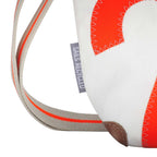 Lieblingstasche Deern Lütt bag made from recycled white and orange sailcloth with a grey label