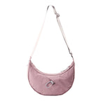Lieblingstasche dusty pink crescent-shaped nylon sling bag with an adjustable strap and silver carabiner detail