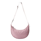Lieblingstasche dusty pink crescent-shaped sling bag with an adjustable shoulder strap and zipper closure