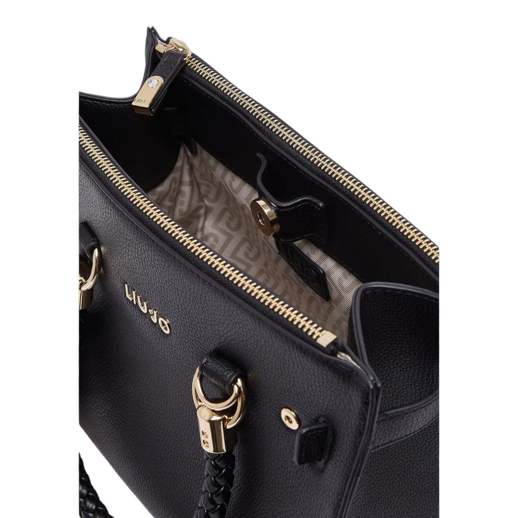 Lieblingstasche ECS Satchel S in black with gold hardware, zipper closure, and branded interior lining.