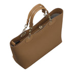 Lieblingstasche ECS Tote L in tan leather with gold chain handles and zip closure on a light grey background