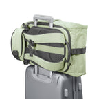 Lieblingstasche eoto Tall41 light green rolltop travel backpack with trolley sleeve attached to a suitcase