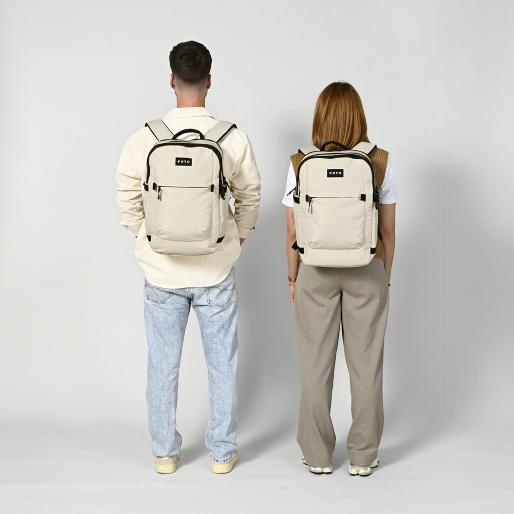 Lieblingstasche eoto Tidy22 beige business backpack worn by a man and woman, showing minimalist design and straps.