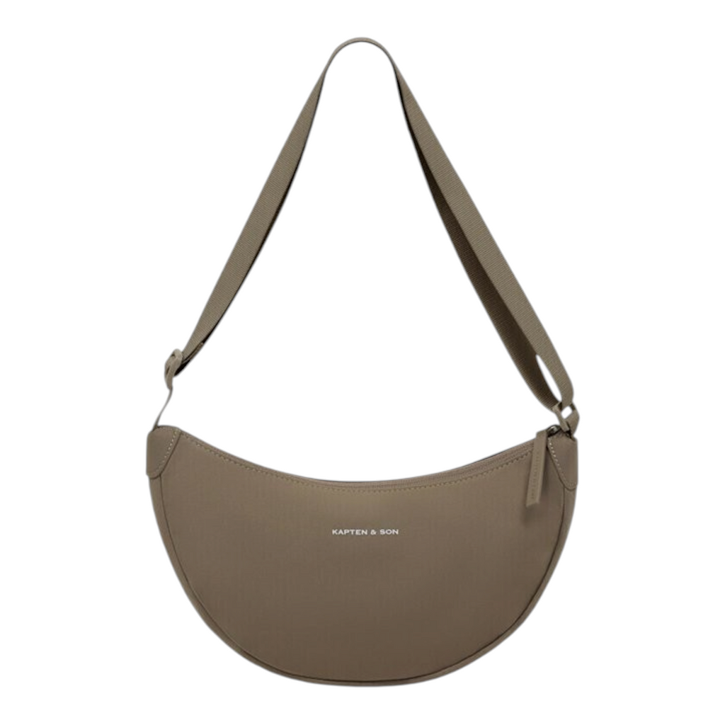 Lieblingstasche Essential Moon Bag in taupe with a curved crescent shape, adjustable strap, and minimalist design.