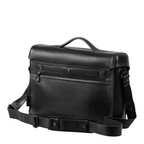 Lieblingstasche Finn black leather messenger bag with a top handle, adjustable shoulder strap, and rear zip pocket.
