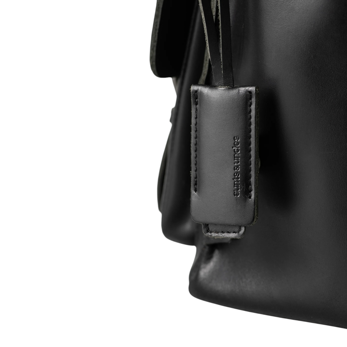 Lieblingstasche Finn black leather bag detail with embossed aunts & uncles logo tag