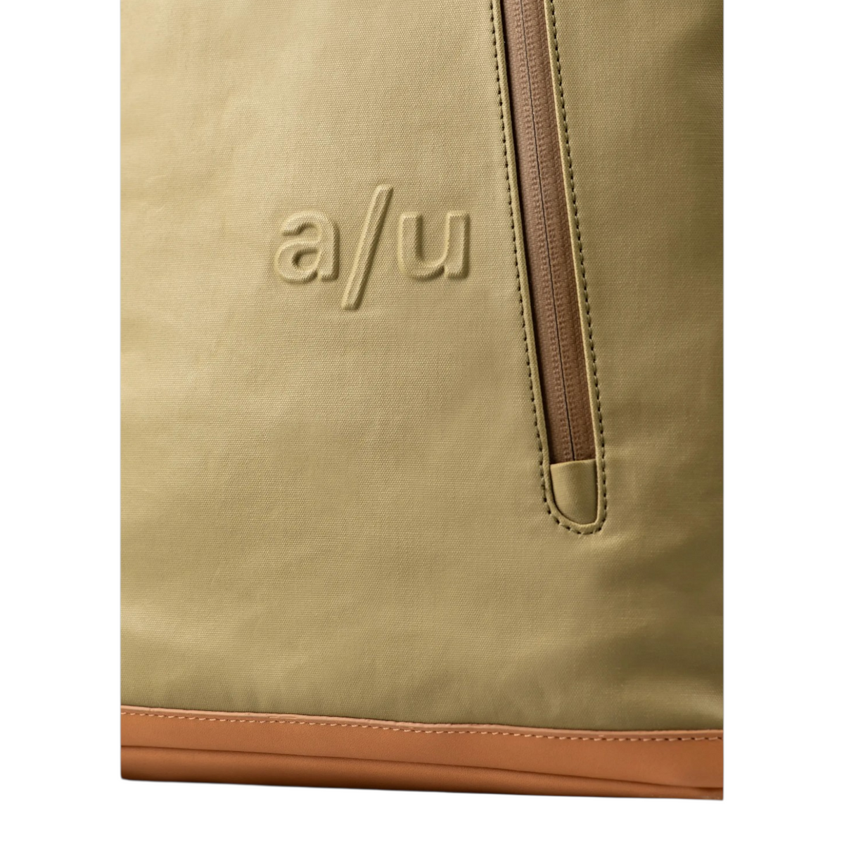 Close-up of the Lieblingstasche a/u Fukui backpack in olive green coated canvas with a vertical front zipper pocket.