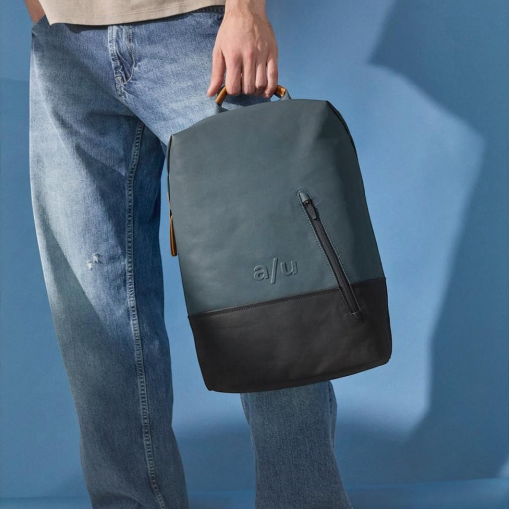 Lieblingstasche a/u by aunts & uncles Hamamatsu backpack in blue coated canvas with a black leather base and zipper