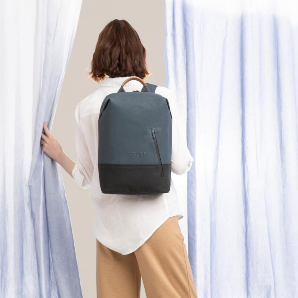 Lieblingstasche a/u by aunts & uncles Hamamatsu backpack in blue and black canvas with leather details on a model