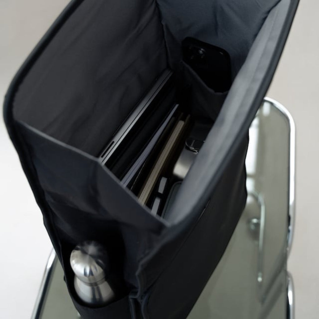 Lieblingstasche Kapten & Son Lund Pro backpack in black with open top showing organized laptop and bottle storage