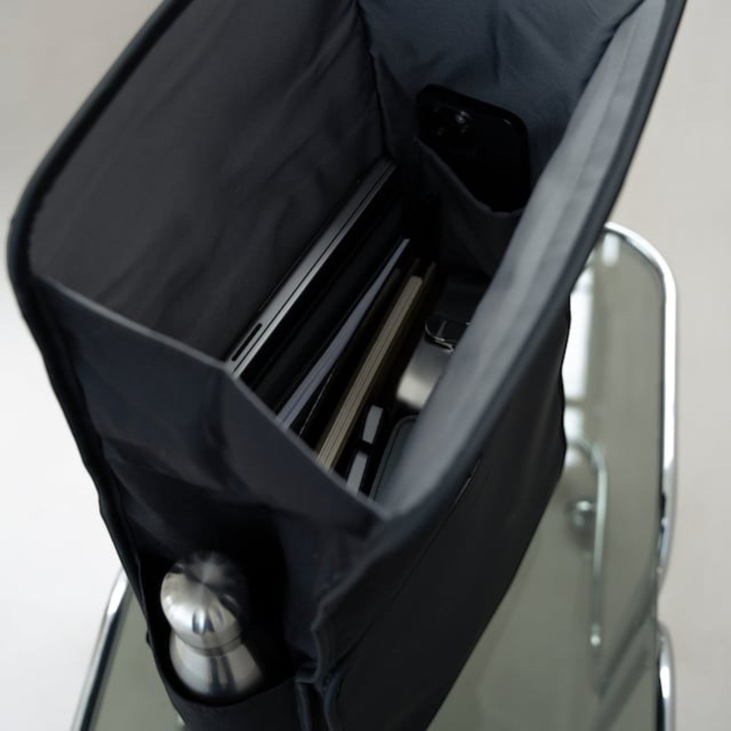 Lieblingstasche Kapten & Son Lund Pro backpack in black with open top showing organized laptop and bottle storage