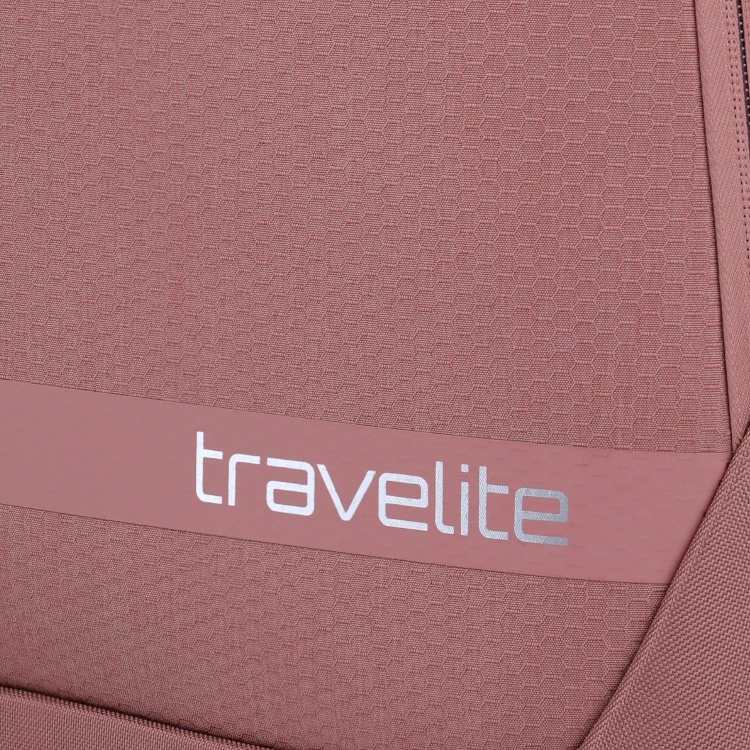 Lieblingstasche KICK OFF trolley suitcase in dusty rose with a textured honeycomb pattern and travelite logo detail