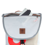 Lieblingstasche Landgang Mini backpack in white sailcloth with a brown leather logo patch and grey trim.