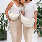 Lieblingstasche large cream crescent-shaped crossbody bag made of smooth leather with adjustable strap.