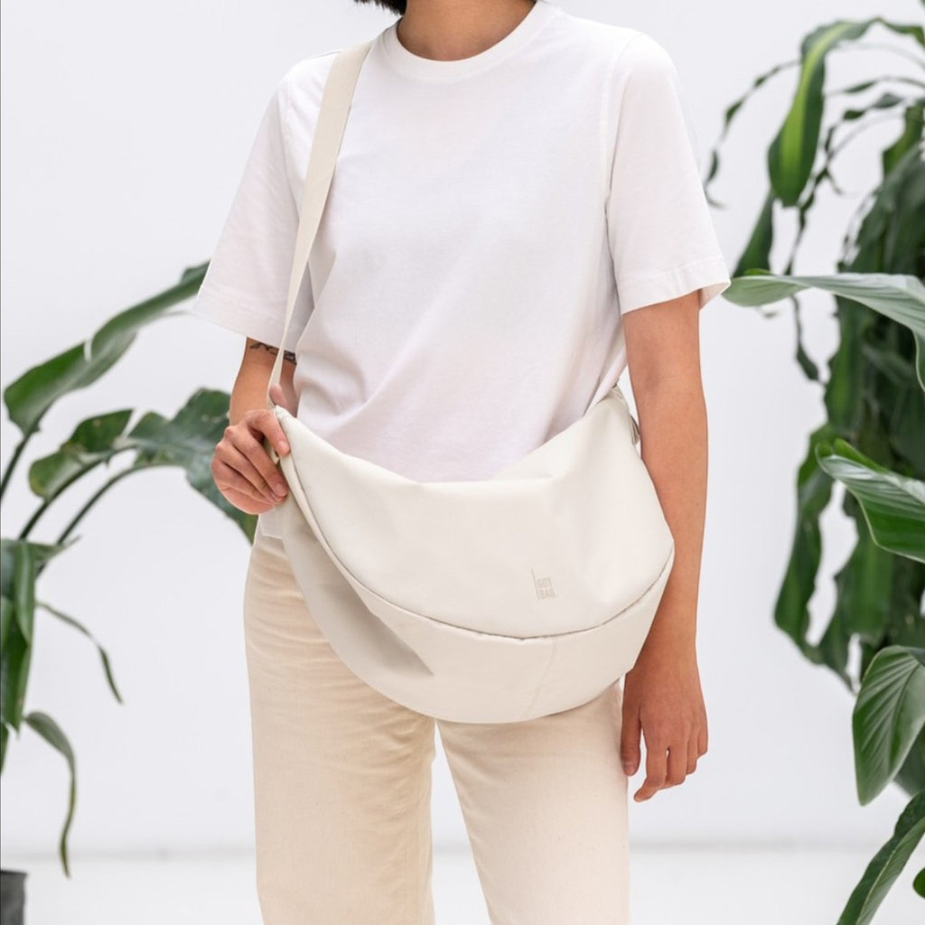 Lieblingstasche large cream leather crescent shoulder bag with adjustable strap.