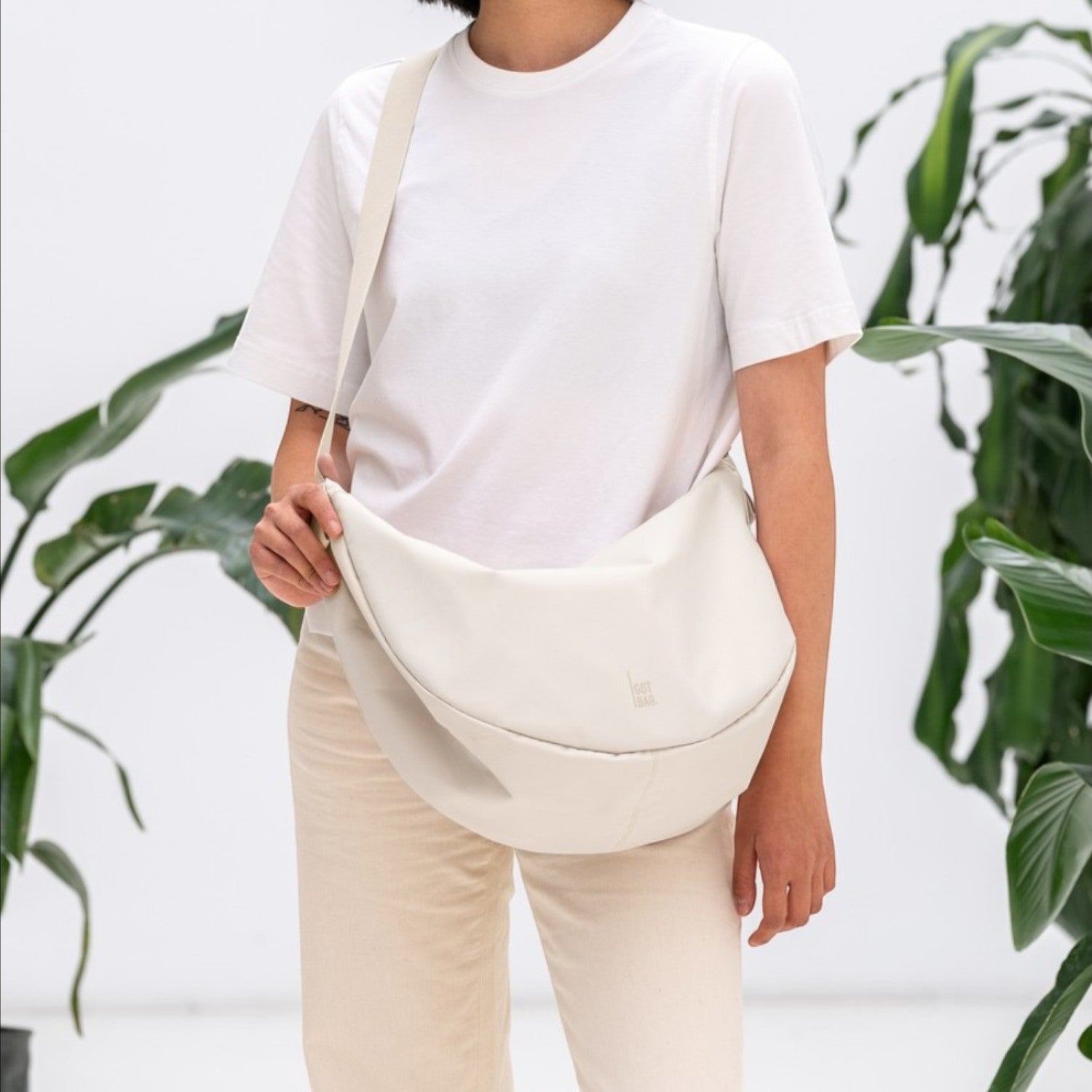 Lieblingstasche large cream leather crescent shoulder bag with adjustable strap.