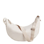 Lieblingstasche large moon bag in light beige nylon with adjustable strap and zip closure.
