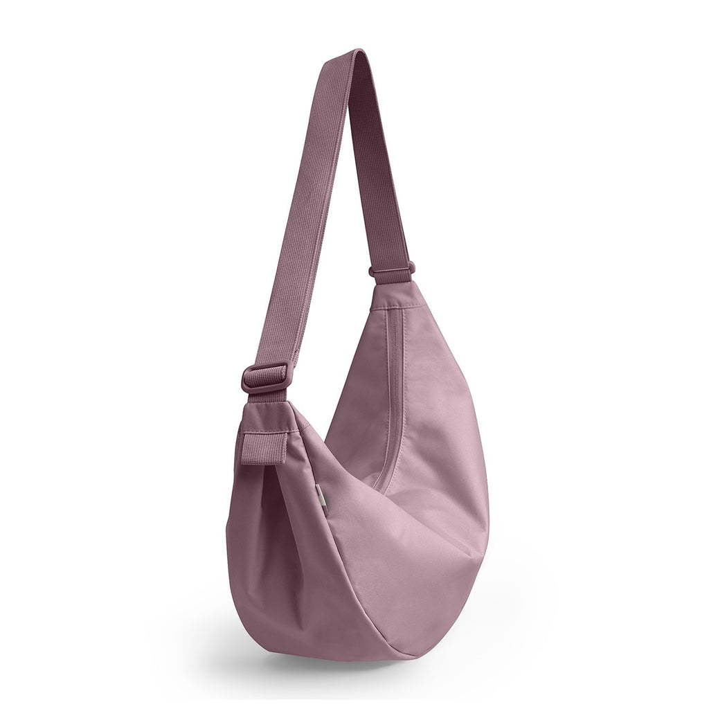 Lieblingstasche Large Moon Bag in dusty rose nylon with adjustable strap.