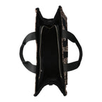 Lieblingstasche Tote Animalier L featuring a leopard print faux fur exterior and black fabric handles, top view.